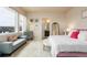 Bright and inviting main bedroom featuring large windows and elegant decor at 6657 S Kline Way, Littleton, CO 80127