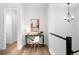 Bright hallway with modern lighting, a desk, and sleek railing at 8242 S Pierson St, Littleton, CO 80127