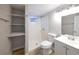 Well-lit bathroom with shower, storage shelves and vinyl floors at 8034 Decatur St, Westminster, CO 80031