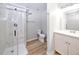 Updated bathroom with white vanity, shower, and modern fixtures at 8034 Decatur St, Westminster, CO 80031