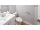 Well-lit bathroom featuring a single sink vanity, toilet, and neutral wall paint at 8034 Decatur St, Westminster, CO 80031
