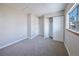 Inviting bedroom with neutral carpet, closet, and a bright window at 8034 Decatur St, Westminster, CO 80031