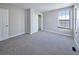 Comfortable bedroom featuring neutral carpet, closet, and a bright window at 8034 Decatur St, Westminster, CO 80031
