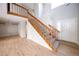 Inviting foyer with wood floors, carpeted stairs, and a bright, open floor plan at 8034 Decatur St, Westminster, CO 80031