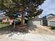 Charming two-story home with attached garage and mature tree in the front yard at 8034 Decatur St, Westminster, CO 80031