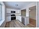Well-lit kitchen featuring stainless steel appliances, white cabinets, and granite countertops at 8034 Decatur St, Westminster, CO 80031
