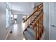 Open living room with staircase, light hardwood floors, fireplace, and lots of natural light at 8034 Decatur St, Westminster, CO 80031
