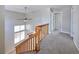 Carpeted staircase and railing leading to the upper level at 8034 Decatur St, Westminster, CO 80031