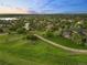 Aerial view of property featuring lush greenery and a long private driveway at 5602 Silver Bluff Ct, Parker, CO 80134