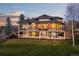 Stunning multi-story home featuring a spacious deck, stone accents, and well-maintained landscaping at 5602 Silver Bluff Ct, Parker, CO 80134