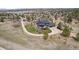 Aerial view of a home featuring a lush green lawn, circular driveway, and mature landscaping at 5602 Silver Bluff Ct, Parker, CO 80134