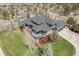 Aerial shot showing a home with a well-kept lawn and a large rear deck, ideal for entertaining at 5602 Silver Bluff Ct, Parker, CO 80134