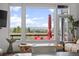 Bright living room with scenic mountain views and cozy outdoor lounge area at 5602 Silver Bluff Ct, Parker, CO 80134