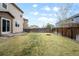 Spacious backyard with lush green grass and a fire pit, perfect for outdoor entertaining at 12715 E 104Th Pl, Commerce City, CO 80022