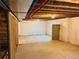 Unfinished basement with concrete floor, insulated walls, exposed ceiling and framing at 12715 E 104Th Pl, Commerce City, CO 80022