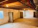 Unfinished basement with concrete floor, insulated walls, exposed ceiling and support columns at 12715 E 104Th Pl, Commerce City, CO 80022