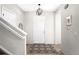Bright entryway with a modern chandelier, a staircase, and a decorative rug at 12715 E 104Th Pl, Commerce City, CO 80022