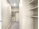 Spacious walk-in closet with shelving and clothing rod, providing ample storage space at 12715 E 104Th Pl, Commerce City, CO 80022