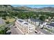 Aerial view of commercial building with mountain views and solar panels on roof at 615 24Th St # 104, Golden, CO 80401