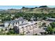 Aerial view of building showing solar panels on the roof with mountain views in the background at 615 24Th St # 104, Golden, CO 80401