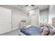 Relaxing bedroom features a large window and a blue patterned comforter set at 615 24Th St # 104, Golden, CO 80401