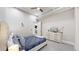 Bedroom features a bed, dresser, and ceiling fan with minimalist décor and a cozy feel at 615 24Th St # 104, Golden, CO 80401