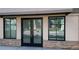 Commercial building entrance features double doors flanked by large windows at 615 24Th St # 104, Golden, CO 80401