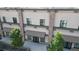 View of the building's exterior, highlighting the stone columns and neutral-colored facade with shade awning at 615 24Th St # 104, Golden, CO 80401