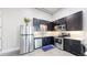 Modern kitchen features dark cabinets, stainless steel appliances, and white countertops at 615 24Th St # 104, Golden, CO 80401