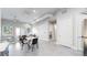 Open living area with modern furnishings, large doors and windows, and an adjacent bedroom at 615 24Th St # 104, Golden, CO 80401