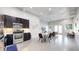 Modern kitchen and living area featuring stainless steel appliances, an eat-in table, and an open floorplan at 615 24Th St # 104, Golden, CO 80401