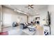 The cozy living room opens to the kitchen, with industrial touches and a large ceiling fan at 615 24Th St # 104, Golden, CO 80401
