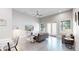 Bright living room featuring a ceiling fan, gray couch, modern furnishings, and lots of natural light at 615 24Th St # 104, Golden, CO 80401