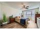 Cozy bedroom with a ceiling fan, and a sunny bay window at 12685 E Pacific Cir # B, Aurora, CO 80014