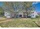 Inviting townhome complex with well-maintained landscaping and mature trees on a sunny day at 12685 E Pacific Cir # B, Aurora, CO 80014