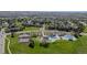 Aerial view of the community with tennis courts, swimming pool, and lush green spaces surrounded by homes at 16158 Whitestone Dr, Parker, CO 80134