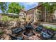 Outdoor patio with fire pit, comfortable seating, and manicured landscaping, perfect for outdoor gatherings at 16158 Whitestone Dr, Parker, CO 80134