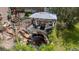 Serene backyard with a koi pond, gazebo, and outdoor seating for relaxation and entertainment at 16158 Whitestone Dr, Parker, CO 80134