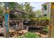 Inviting backyard patio with comfortable seating, vibrant pond, and artistic decor for outdoor relaxation and entertaining at 16158 Whitestone Dr, Parker, CO 80134