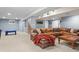 Finished basement with recessed lighting, a large sofa, carpet flooring, and space for recreation and entertainment at 16158 Whitestone Dr, Parker, CO 80134