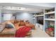 Basement living area featuring a leather sectional, a wooden coffee table and recessed lighting at 16158 Whitestone Dr, Parker, CO 80134