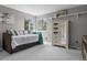 Comfortable bedroom featuring natural light, neutral tones, and a mirrored wardrobe for ample storage at 16158 Whitestone Dr, Parker, CO 80134