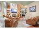 Spacious living room with a fireplace, comfortable seating, and a large television at 16158 Whitestone Dr, Parker, CO 80134