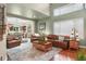 Comfortable living room with a neutral palette, hardwood floors, and ample natural light at 16158 Whitestone Dr, Parker, CO 80134