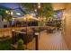 Beautiful outdoor deck with gazebo, string lights, and dining set, perfect for evening entertainment and relaxation at 16158 Whitestone Dr, Parker, CO 80134
