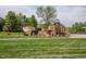 Vibrant park playground with climbing structures, slides, and swings surrounded by green grass at 16158 Whitestone Dr, Parker, CO 80134