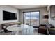Inviting living room with a large window, city views, and a contemporary seating area at 1643 Boulder St # 209, Denver, CO 80211