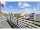 Balcony view showing nearby buildings and street on a sunny day with cloudy skies at 1299 Osceola St, Denver, CO 80204