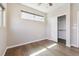 Clean bedroom with hardwood flooring, a closet, and natural light from window at 1299 Osceola St, Denver, CO 80204