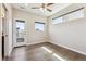 Bright bedroom featuring hardwood floors, balcony access, and natural lighting at 1299 Osceola St, Denver, CO 80204
